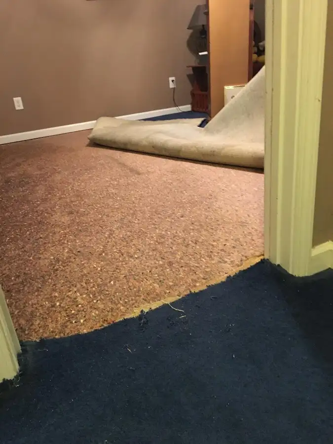Carpet pad removal revealing water damage during Water Mitigation Services in Redwood City